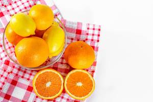 Oranges, lemons, tangerines in a glass bowl