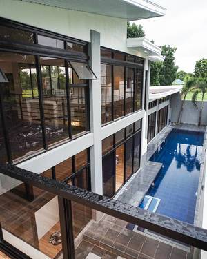 Overlooking the poolside of a new villa