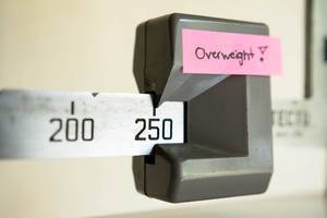 OVERWEIGHT note on the 250 pound mark