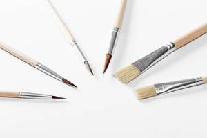 Paint brushes on white background (Flip 2019)