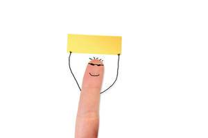 Painted happy finger holding empty sticky note