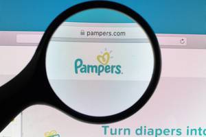 Pampers logo under magnifying glass