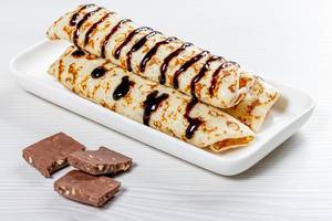 Pancakes with chocolate topping with chocolate chips (Flip 2019)