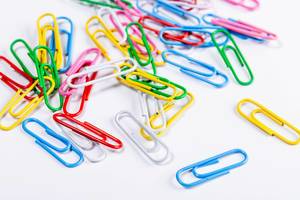 Paper clips on white background (Flip 2019)