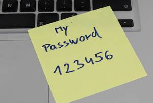 Password 123456 written on a paper