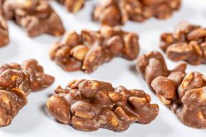 Peanuts, hazelnuts and filbert in milk chocolate