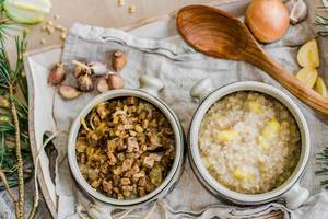 Pearl Barley Porridge With Meat And Veggies On Background