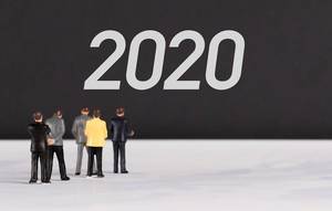 People standing in front of 2020 text