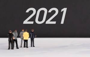 People standing in front of 2021 text