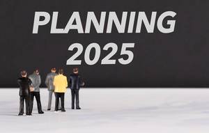 People standing in front of Planning 2025 text