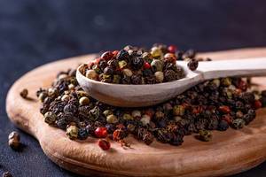 Pepper mixture in a wooden spoon
