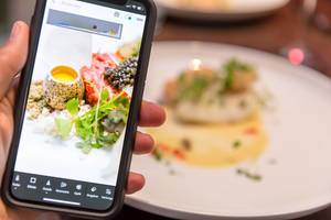 Person taking Food Photo with Adobe Lightroom Application with Smartphone