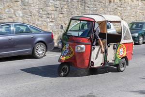 Piaggio Tuk Tuk painted with the flag of Portugal
