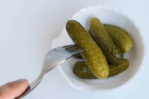 Pickled Cucumber Pricked on the Steel Fork