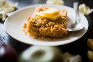 Piece of baked apple crisp on a plate