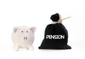 Piggy bank and money bag with Pension text on white background