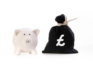 Piggy bank and money bag with pound symbol