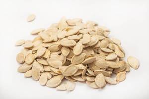 Pile of dried Pumpkin Seeds on the white background
