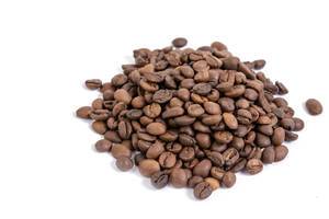Pile of Raw Coffee above white background
