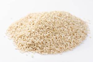 Pile of Raw Sesame seeds on the white background (Flip 2019)
