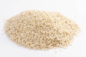 Pile of Raw Sesame seeds on the white background
