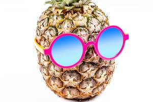 Pineapple in a sunglasses on white background (Flip 2020)