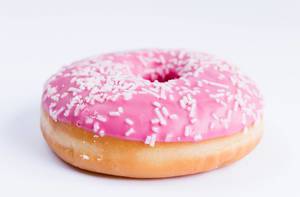 Pink donut with white sprinkles