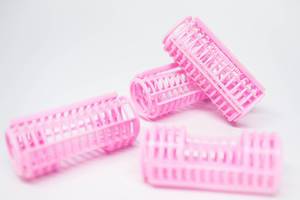 Pink hair curler tubes