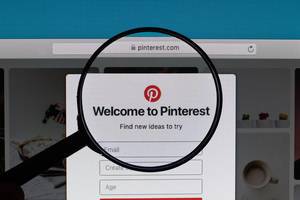 Pinterest website under magnifying glass
