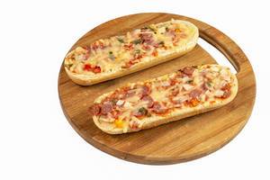 Pizza Baguette on the round wooden board