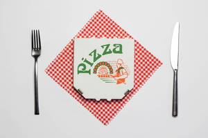 Pizza box with fork and knife
