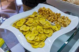 Plantain chips (made from a special variety of banana that is cooked before consumption) and giant corn from Peru