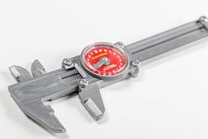 Plastic caliper-childrens toy on a white background