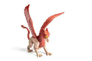 Plastic model of the mythical griffin on a white background