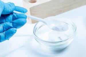 Plastic spoon with white powder. Working with reagents (Flip 2020)