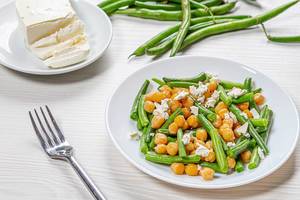 Plate with diet salad with chickpeas, asparagus and feta cheese. Healthy eating concept (Flip 2019)