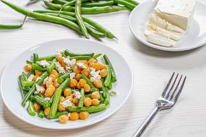 Plate with diet salad with chickpeas, asparagus and feta cheese. Healthy eating concept