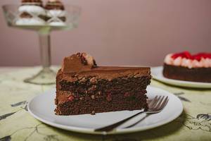 Plate with slice of tasty homemade chocolate cake