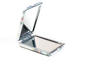 Pocket mirror open on a white background