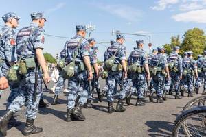 Police officers with long truncheons during World Cup 2018