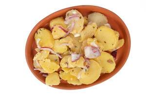 Potatoe Salad with sliced Onions above white background