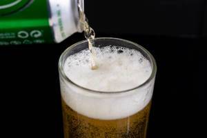 Pouring Heineken Canned Beer in the glass