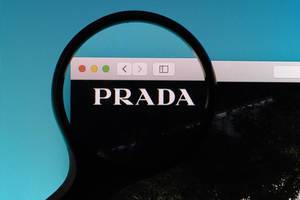 Prada logo under magnifying glass