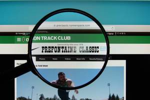 PreClassic.com website on a computer screen with a magnifying glass