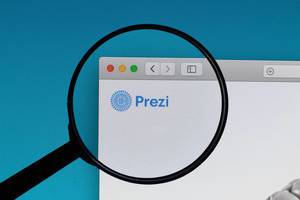 Prezi logo under magnifying glass