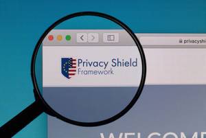 Privacy Shield Framework logo under magnifying glass
