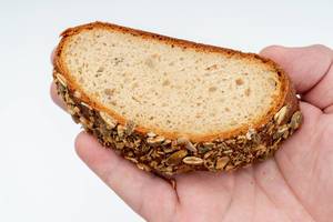 Protein Bread with Pumpkin seed on the hand (Flip 2019)
