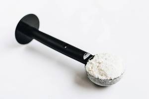 Protein powder in a spoon