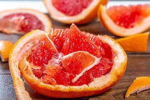 Pulp of ripe grapefruit and its peel close-up