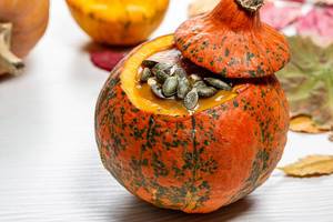 Pumpkin puree with pumpkin seeds. Halloween food concept